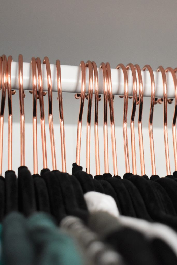 Black velvet hangers with rose fold hooks